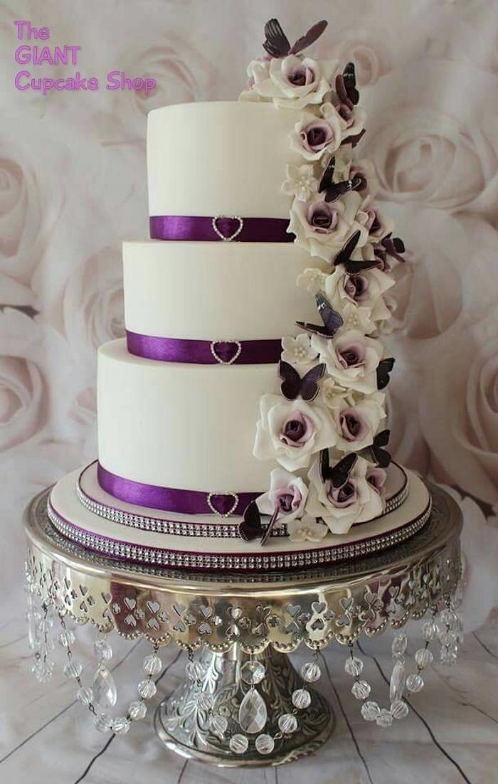 Purple butterflies and rose wedding cake