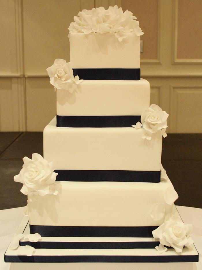 Simple white and navy wedding cake