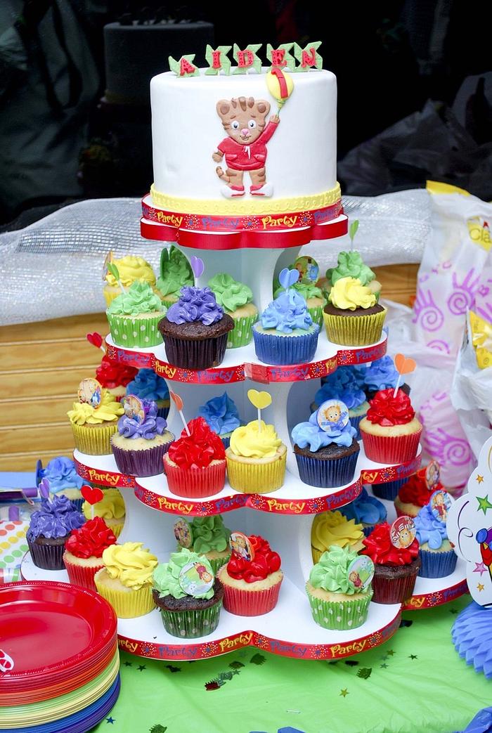 A Daniel tiger cake and cupcakes