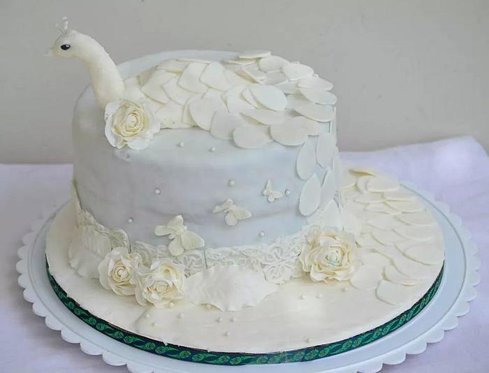 white peacock anniversary cake