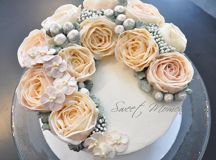 Crescent style buttercream flowers cake