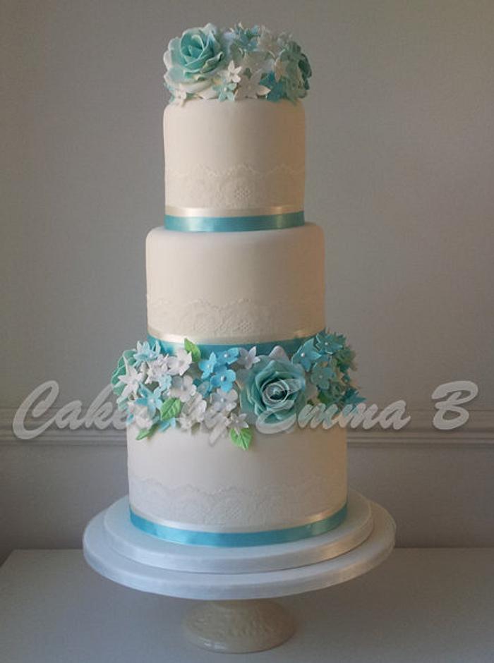 Vintage Three Tier Lace and Blue Rose Wedding Cake
