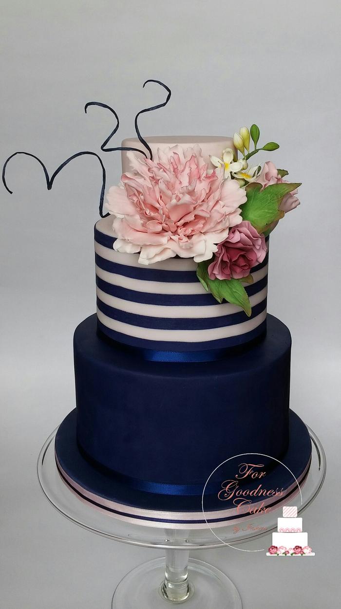 Navy blue striped cake with fringed peony
