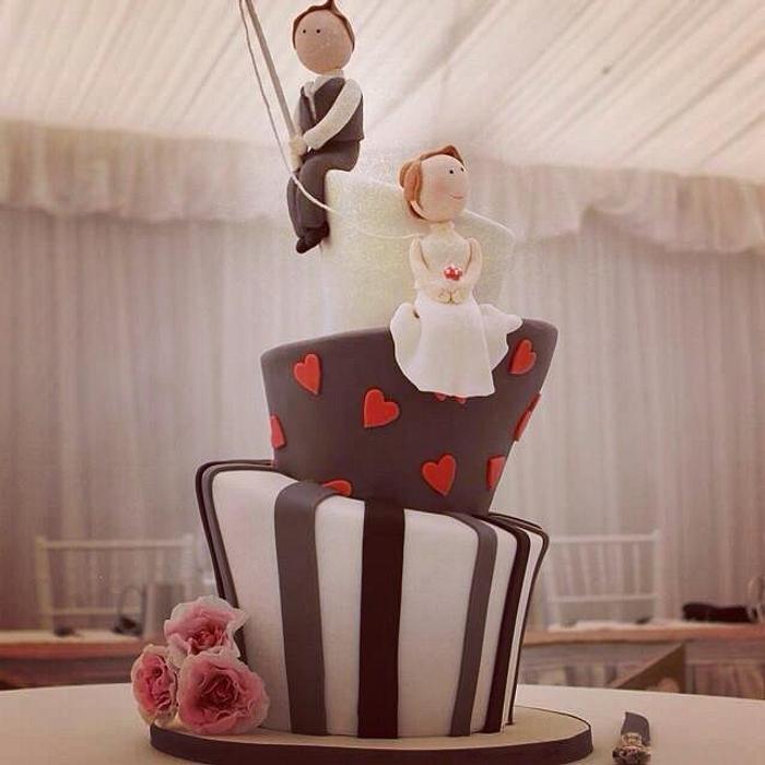 Mad Hatter wedding cake with fishing groom