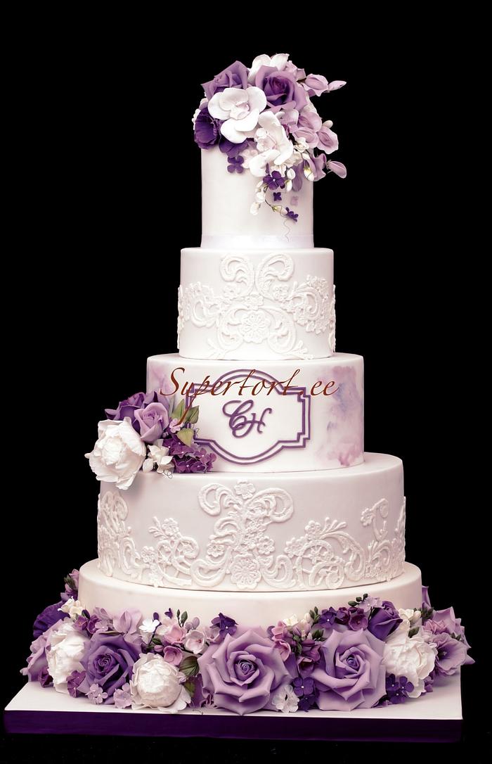 Wedding cake in white and purple colors.