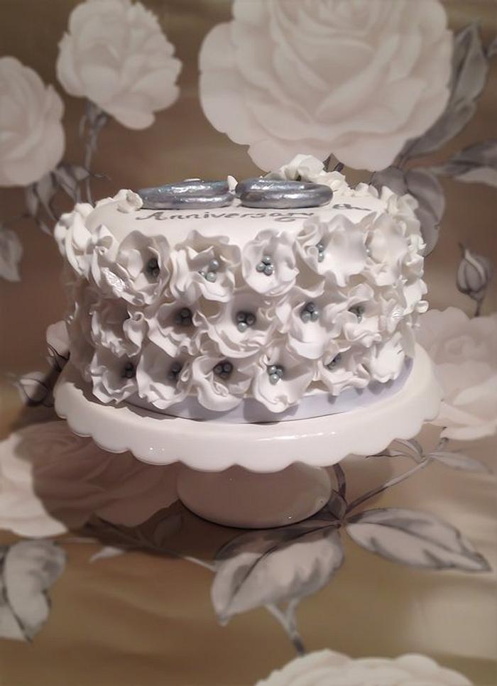 Ruffle flower silver anniversary cake 