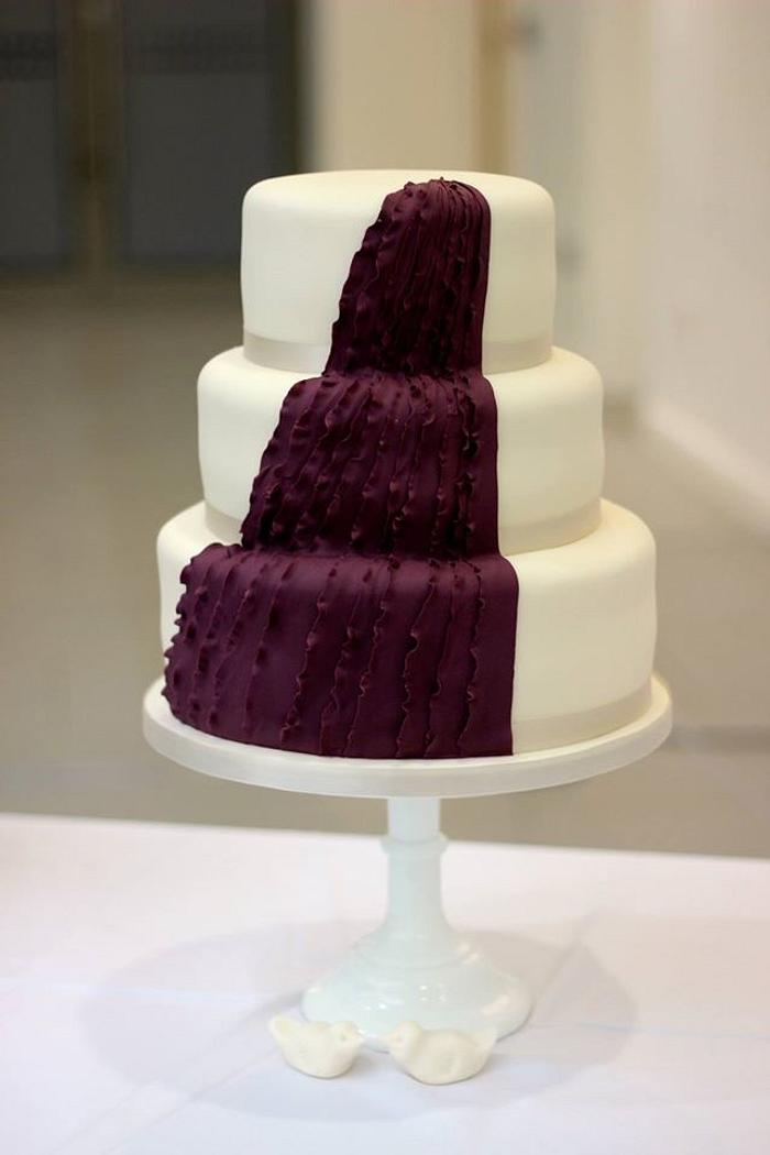Asymmetrical purple ruffle wedding cake