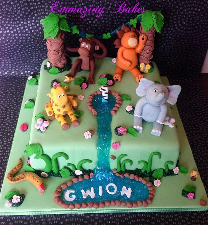 Jungle theme animals cake with swinging vines!