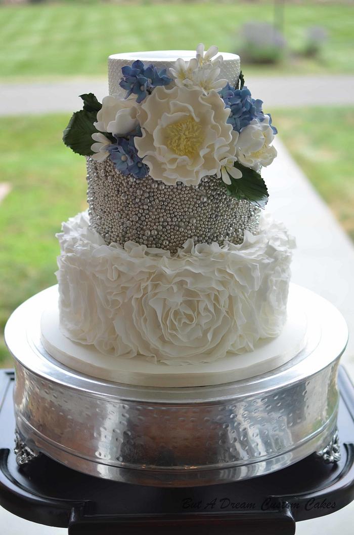 Ruffled and beaded wedding cake