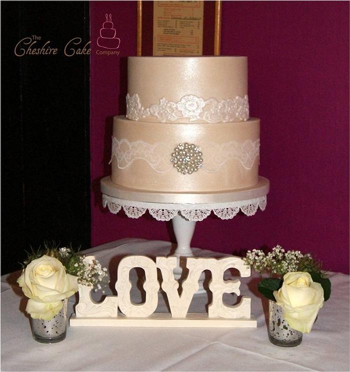 Lace and brooch wedding cake