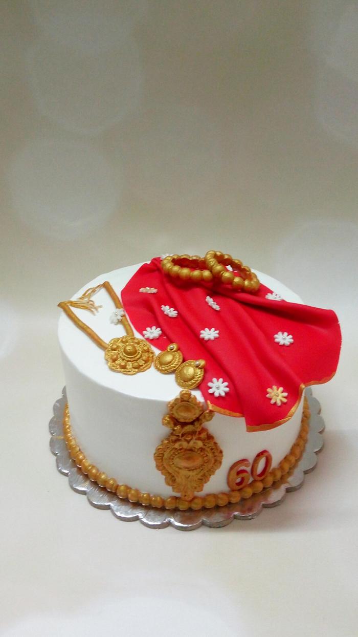 Fresh cream cake with saree and some jewels