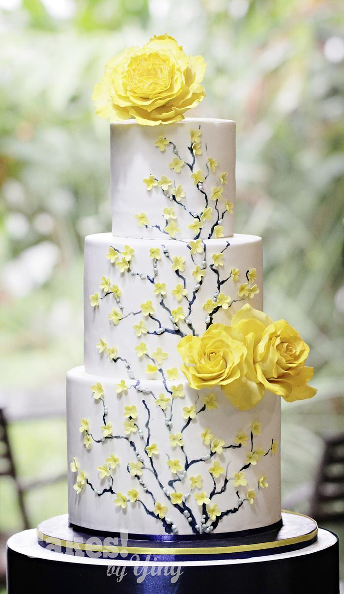 Peony, roses and forsythias wedding cake