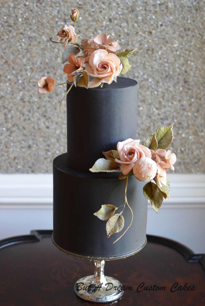 Blush sugar roses on black cake