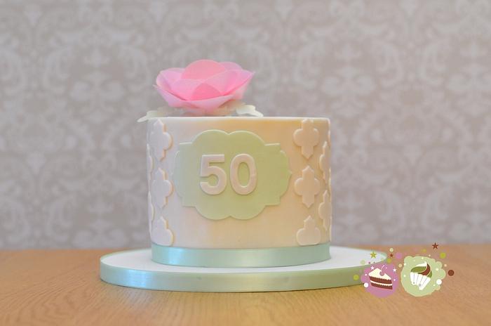 Wafer rose and mint green 50th birthday cake