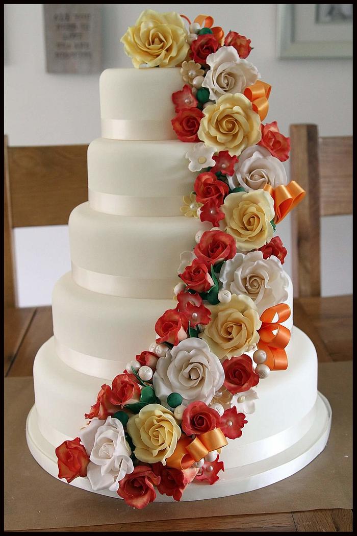 5 Tiered wedding cake with handmade flowers 