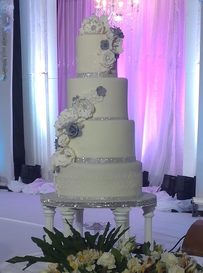 White, Silver, and Gray Wedding Cake with Handmade Flowers