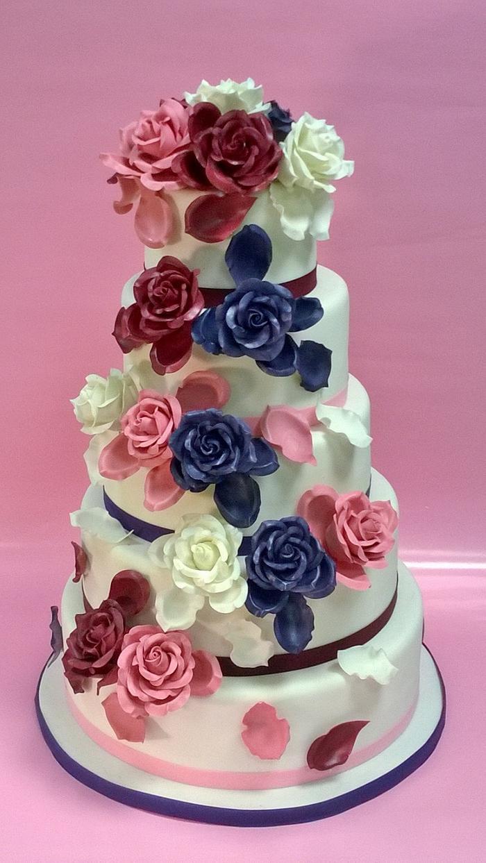 blue rose , violet and white roses wedding cake