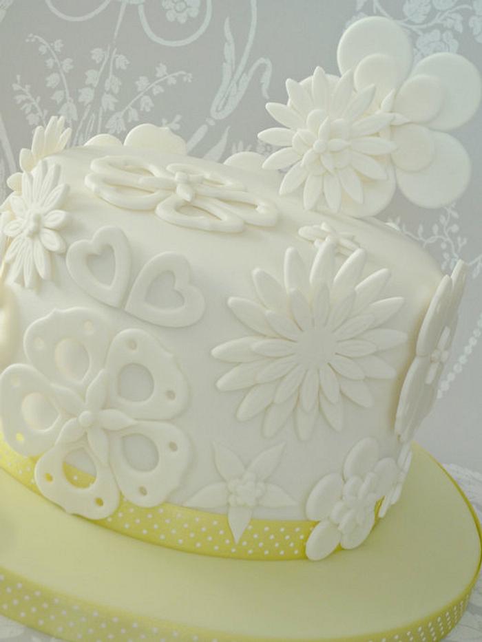 White cut out flower cake