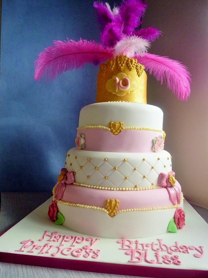 A three tier Tie Dye Cake with Sugar Crown