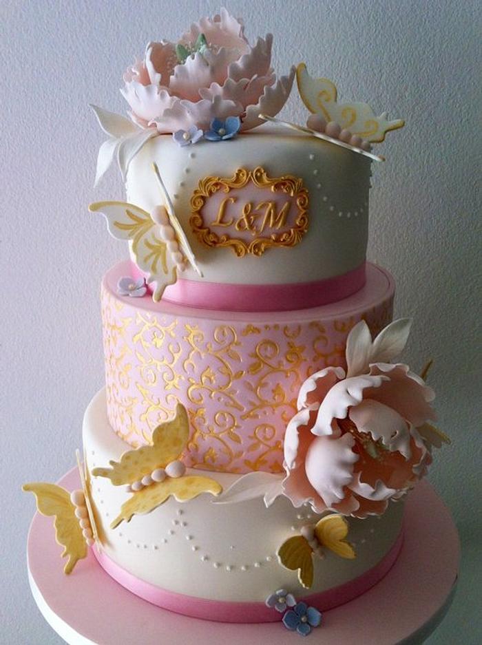 Wedding anniversary cake in pink and gold