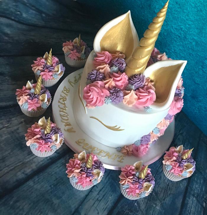 Pastel pink unicorn cake and cupcakes
