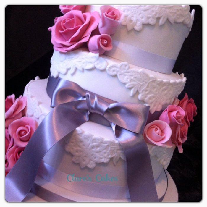 white, lace and roses wedding cake