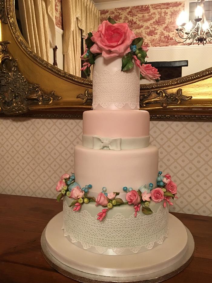Flowers, buds and lace wedding cake