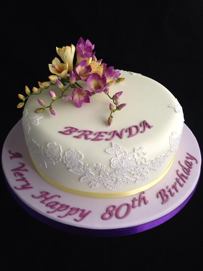 Purple and lemon freesias 80th birthday cake 