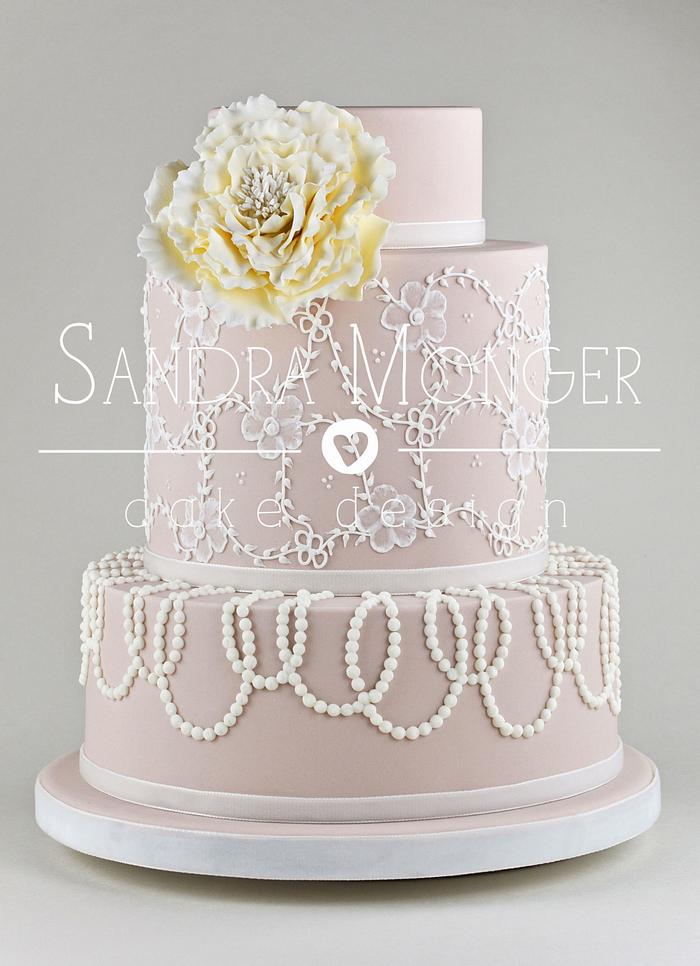 Nude lace and bead piped wedding cake