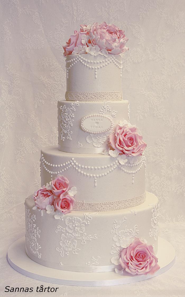 Lace and pearl wedding cake.