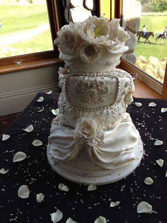 White floral Topsy Turvy Wedding Cake