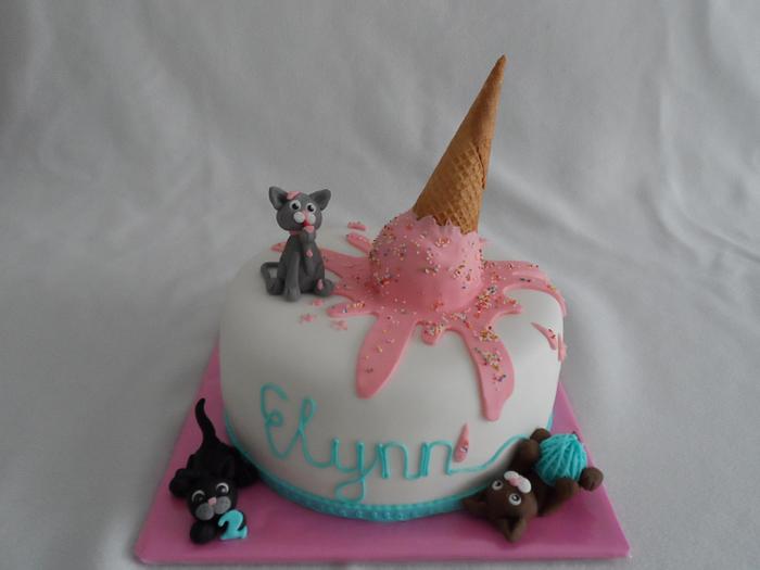 A cake with cats en ice cream