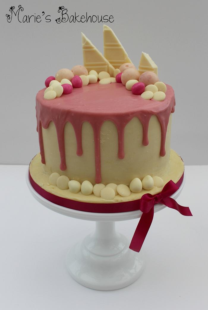 Pink and white drippy ganache cake