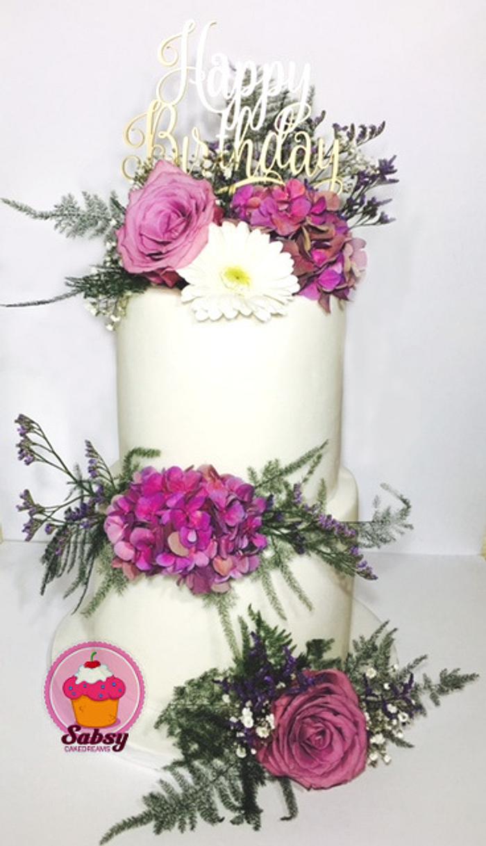purple double barrel birthday cake