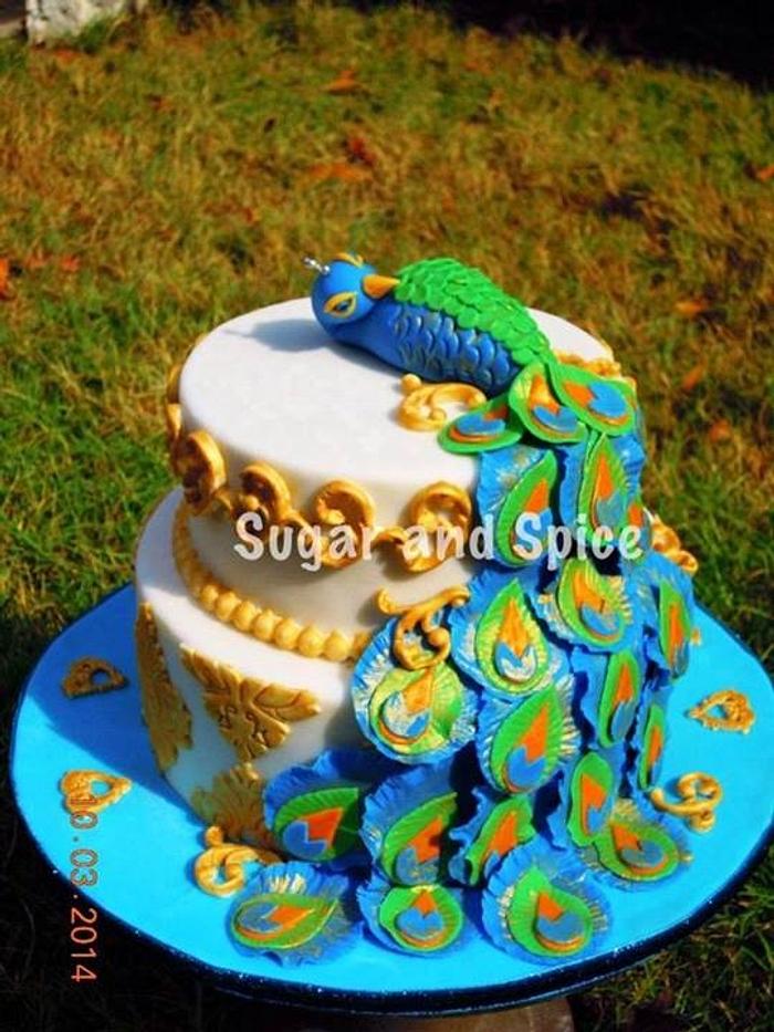 Peacock themed engagement cake