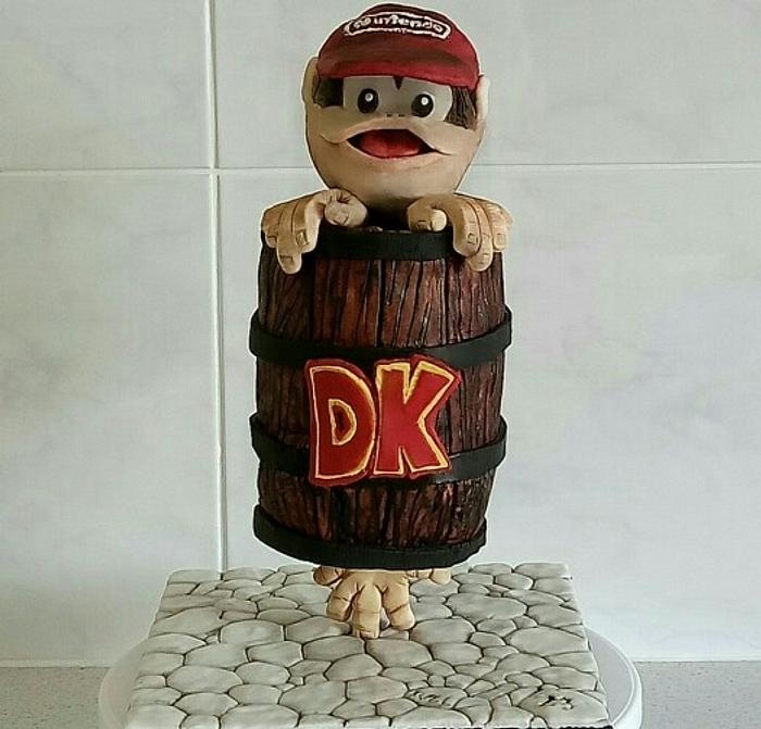 Gravity defying Diddy Kong stuck in a DK barrel cake.