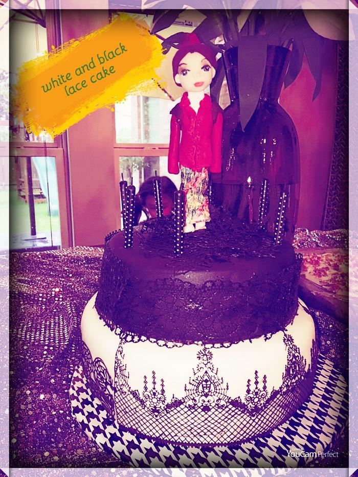 Black and white cake with Indonesian lady topper