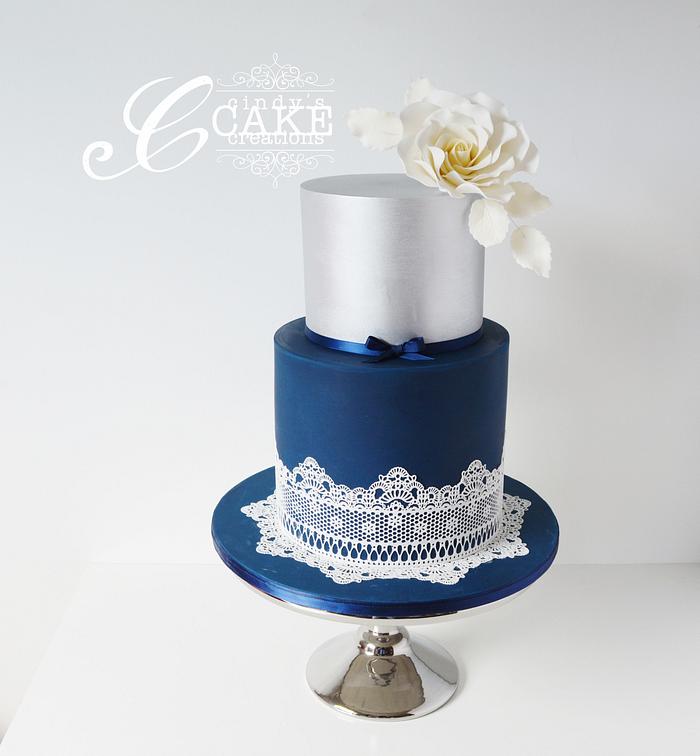 Navy and silver lace wedding cake.