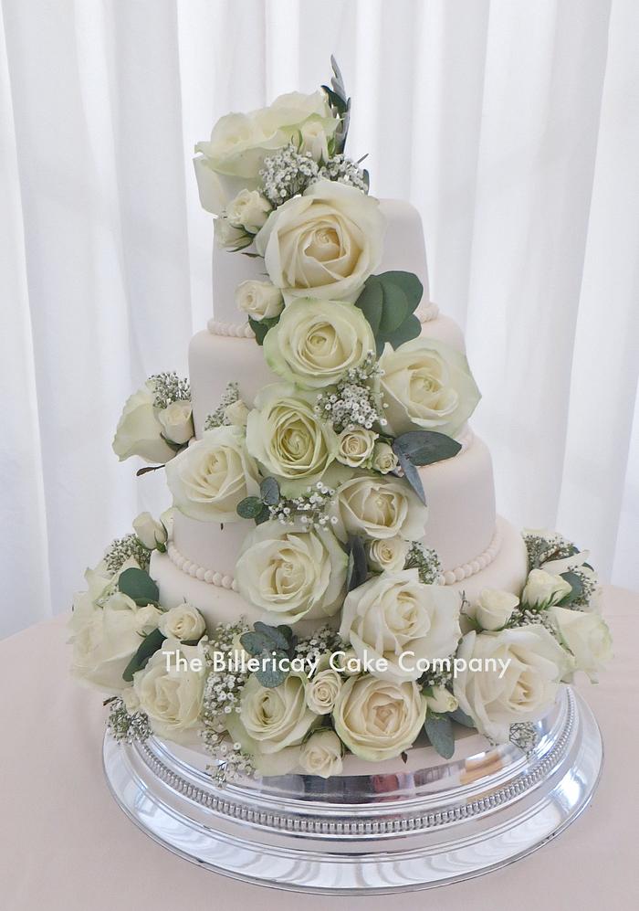 Ivory wedding cake with real flowers