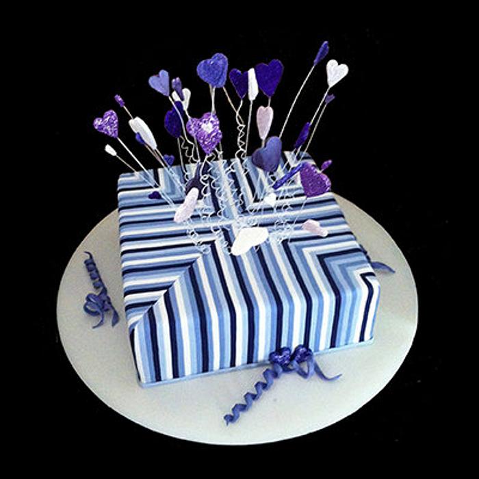 Purple & white striped engagement cake