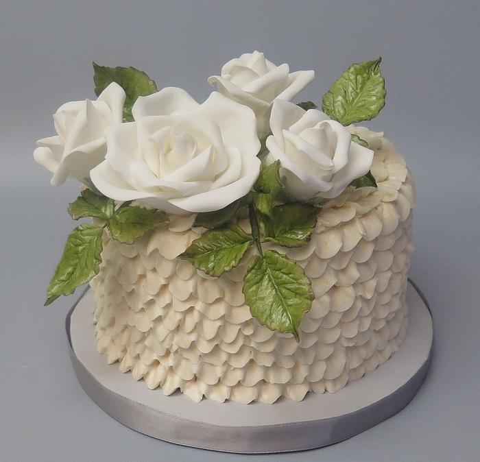 White roses and buttercream ruffles cake