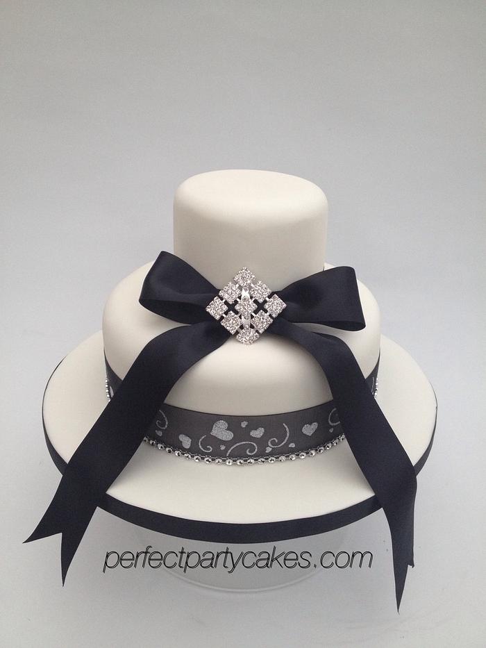 Simple two tier brooch wedding cake