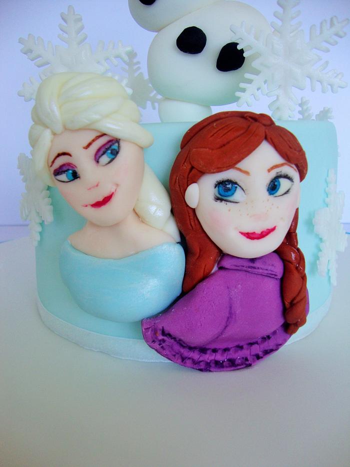 Frozen cake with Beauty and the Beast cupcakes