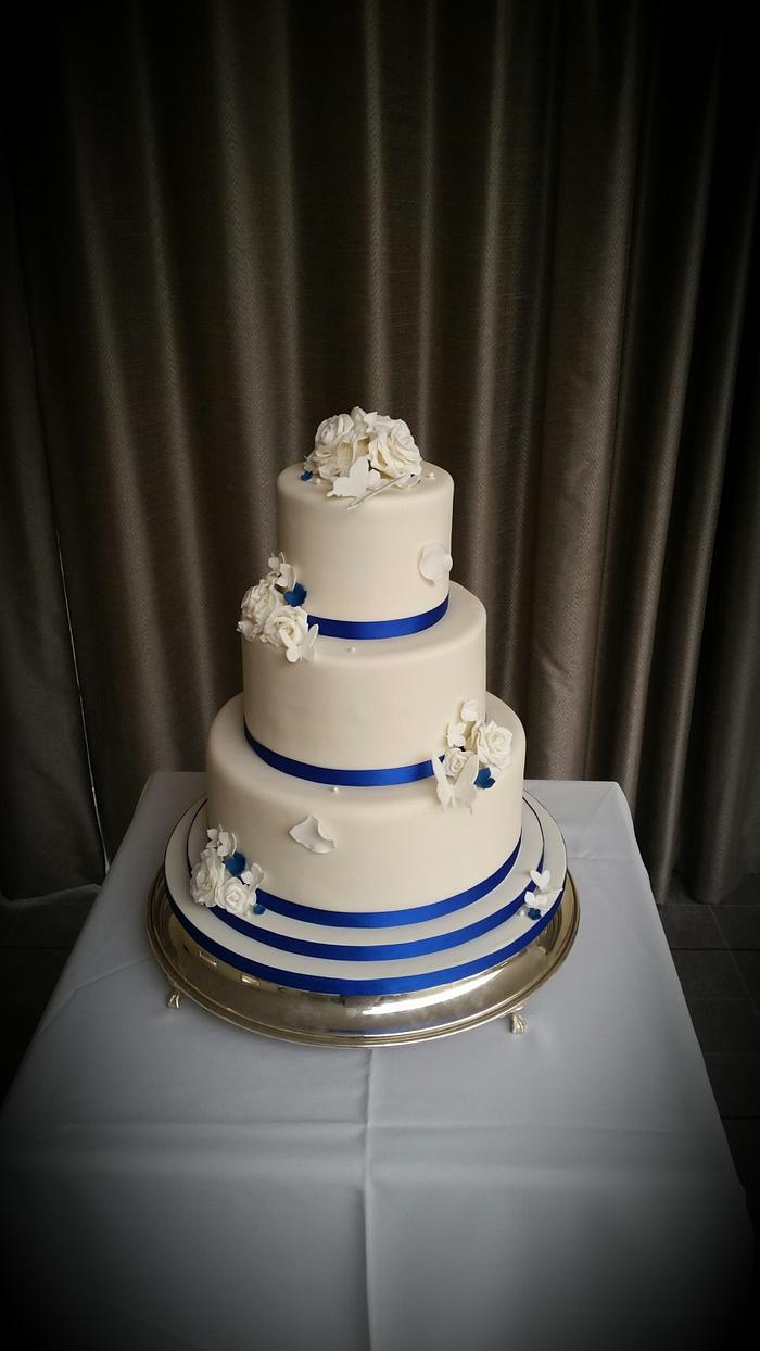 Royal blue and ivory wedding cake 