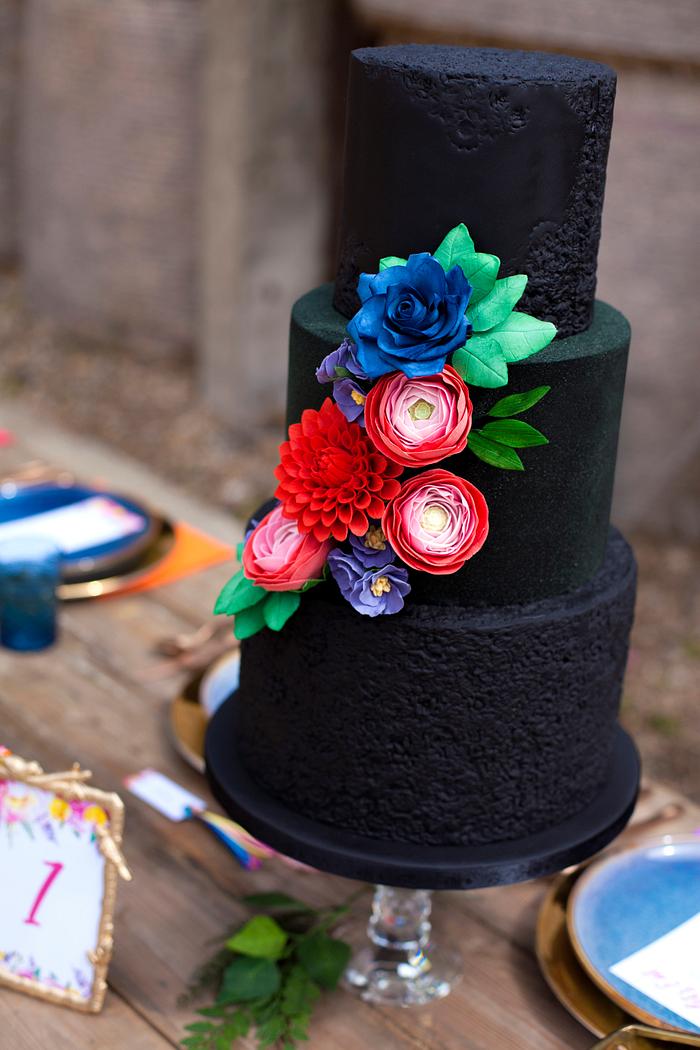 Black beauty textured cake with bright flowers