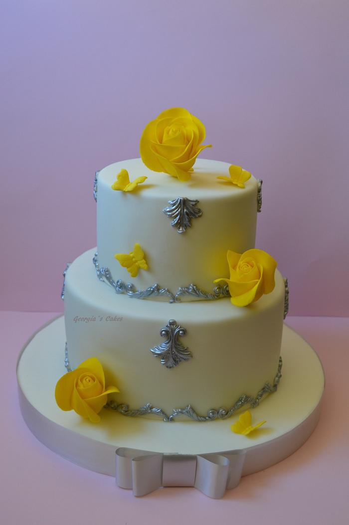 Birthday cake in silver and yellow roses