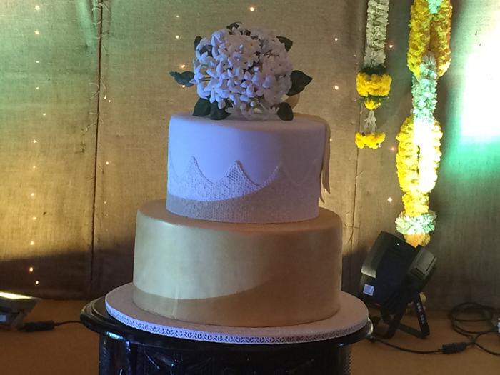 Wedding cake with a bouquet of jasmine flower