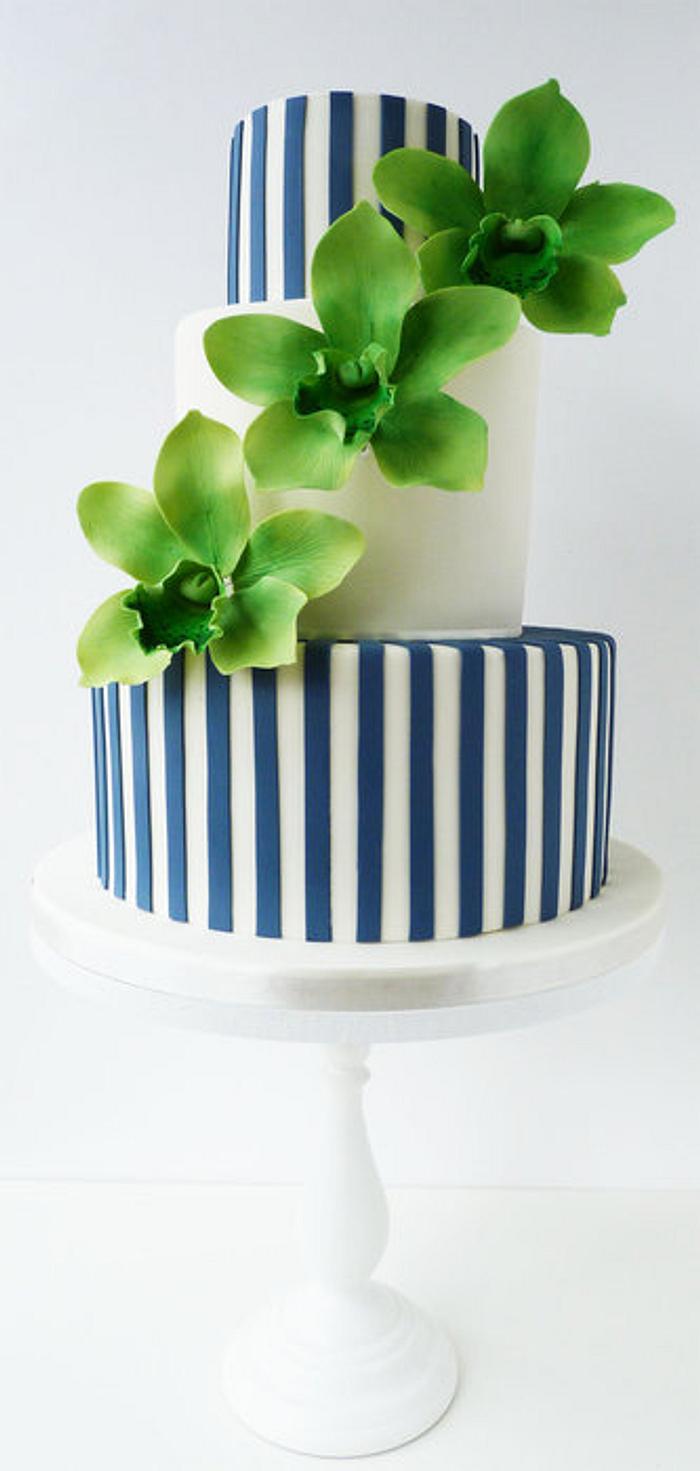 green orchids and Navy stripes wedding cake
