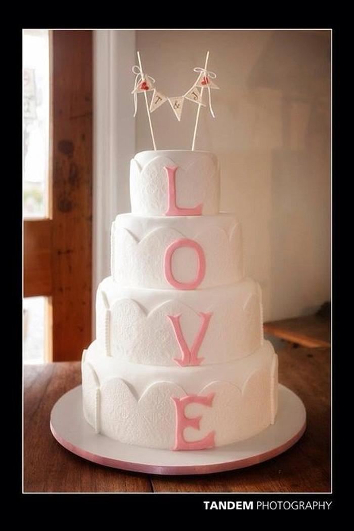Four tiers 'LOVE' wedding cake.