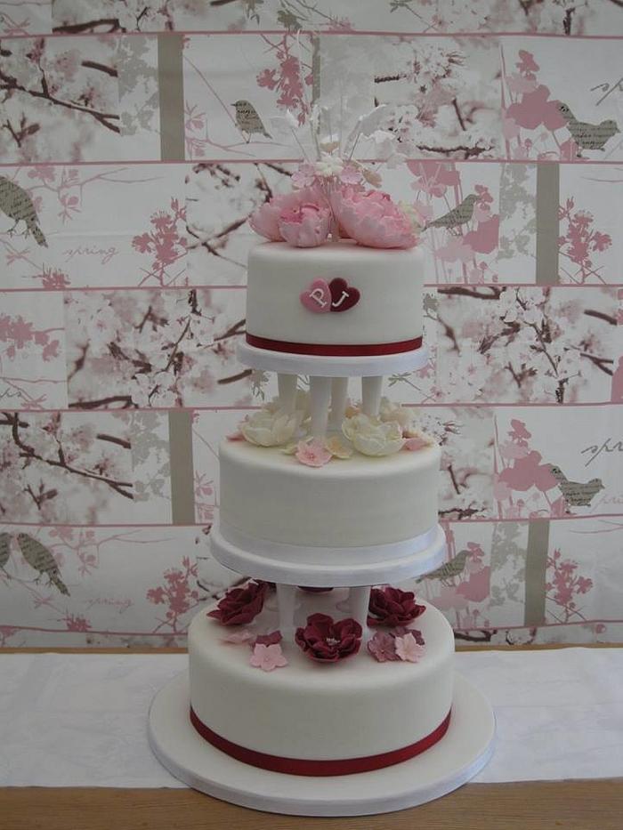 Wedding Cake with pink, cream and burgundy roses & peonies
